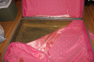 Recycled crafts: removing lining from the repurposed suitcase Recycled crafts: removing lining from the repurposed suitcase