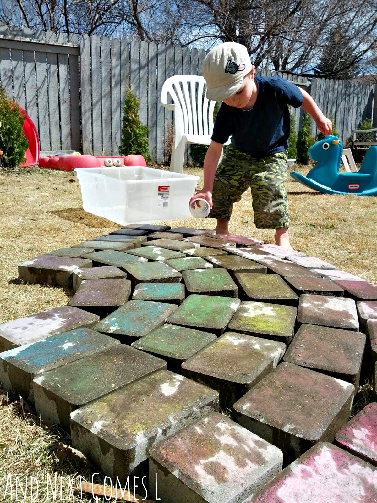 Water play for kids using a giant chalk rainbow from And Next Comes L Water play for kids using a giant chalk rainbow from And Next Comes L