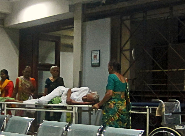 old patient on a stretcher in a hospital