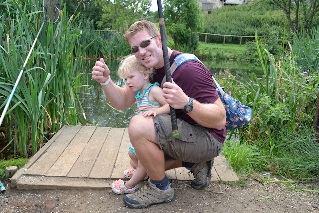 Mr Tin Box and Tin Box Tot holding a fish