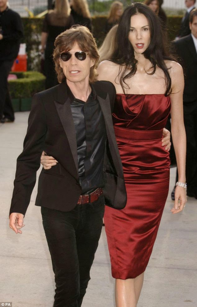 Mick Jagger seduced to a young mystery brunette at the hotel in Switzerland The 70-year-old, Mick Jagger seemed pleased to his music salary as he was snapped hanging out with a young mystery brunette at the hotel in Zurich, Switzerland on Saturday, June 7, 2014.