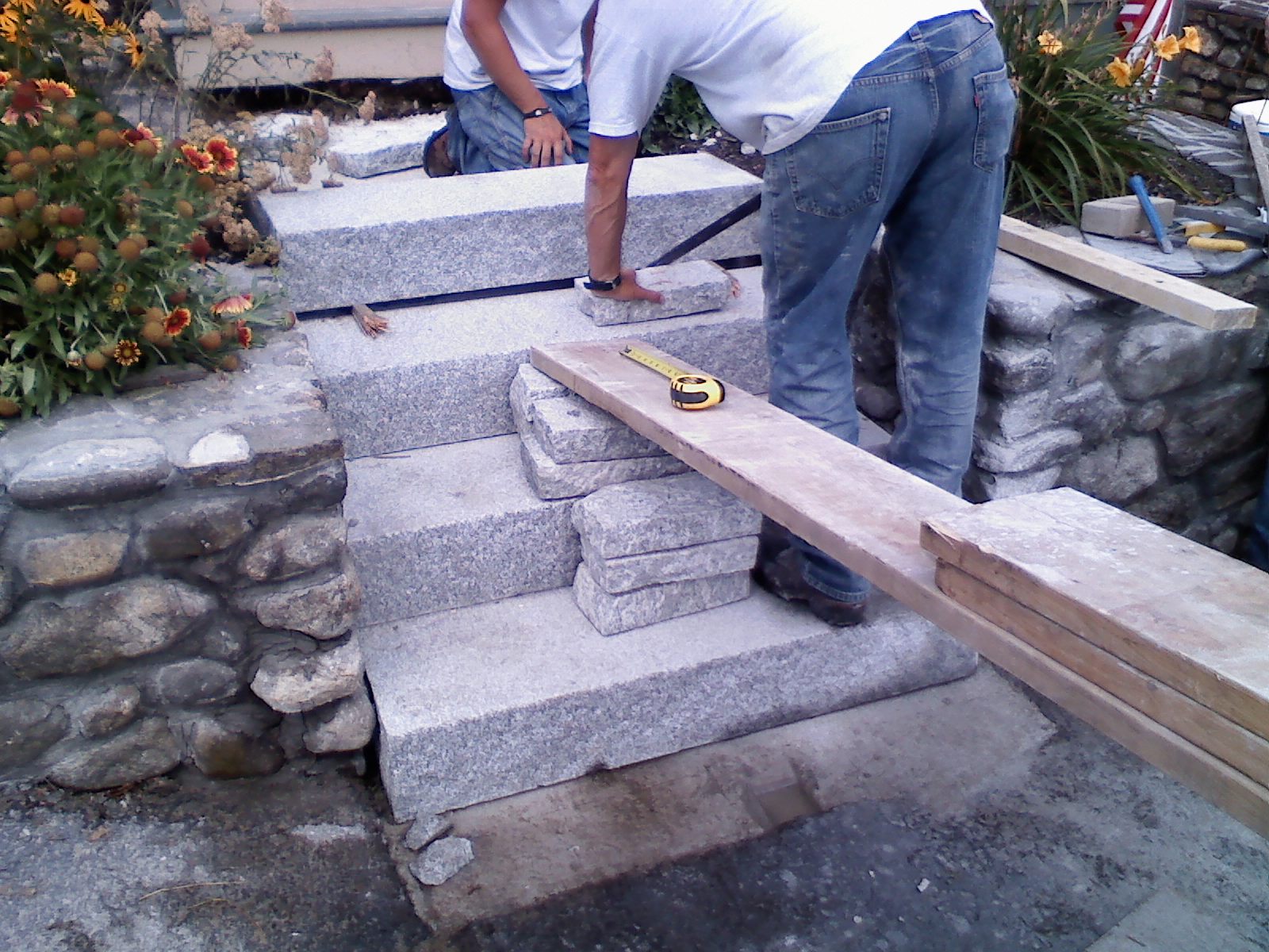 RL Sanborn Masonry Solid granite steps installation with cobblestone