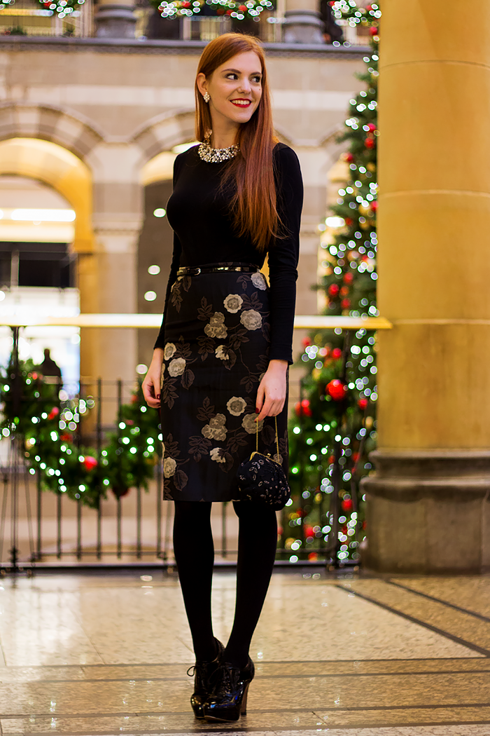 Fashion Blogger Christmas Outfit with a black and gold midi skirt and statement necklace