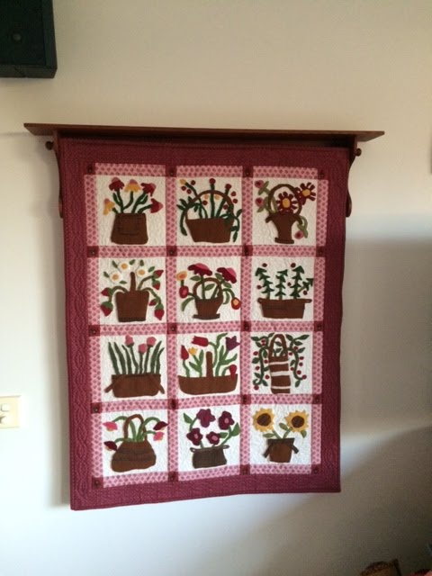 Wooden quilt hanger is hung 