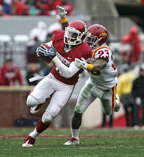 Wide receiver Kameel Jackson #18 of the Oklahoma Sooners is grabbed by cornerback Leonard Johnson #23 of the Iowa State Cyclones in the second half November 26, 2011 at Gaylord Family-Oklahoma Memorial Stadium in Norman, Oklahoma. Oklahoma defeated Iowa State 26-6. (November 25, 2011 - Source: Brett Deering/Getty Images North America)