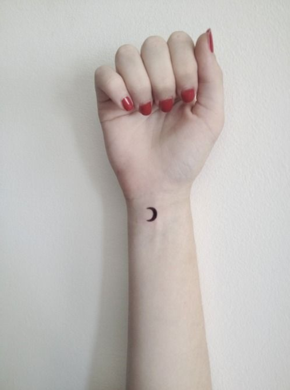 Cute first moon tattoo on wrist