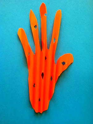 Folded orange Paper ... you decide... Carrot Hand or Cheese Hand 