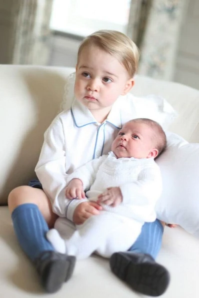 Kensington Palace on Saturday released the first official portrait of Prince George and his new sister Princess Charlotte. It was taken by Kate Middleton in mid-May. 