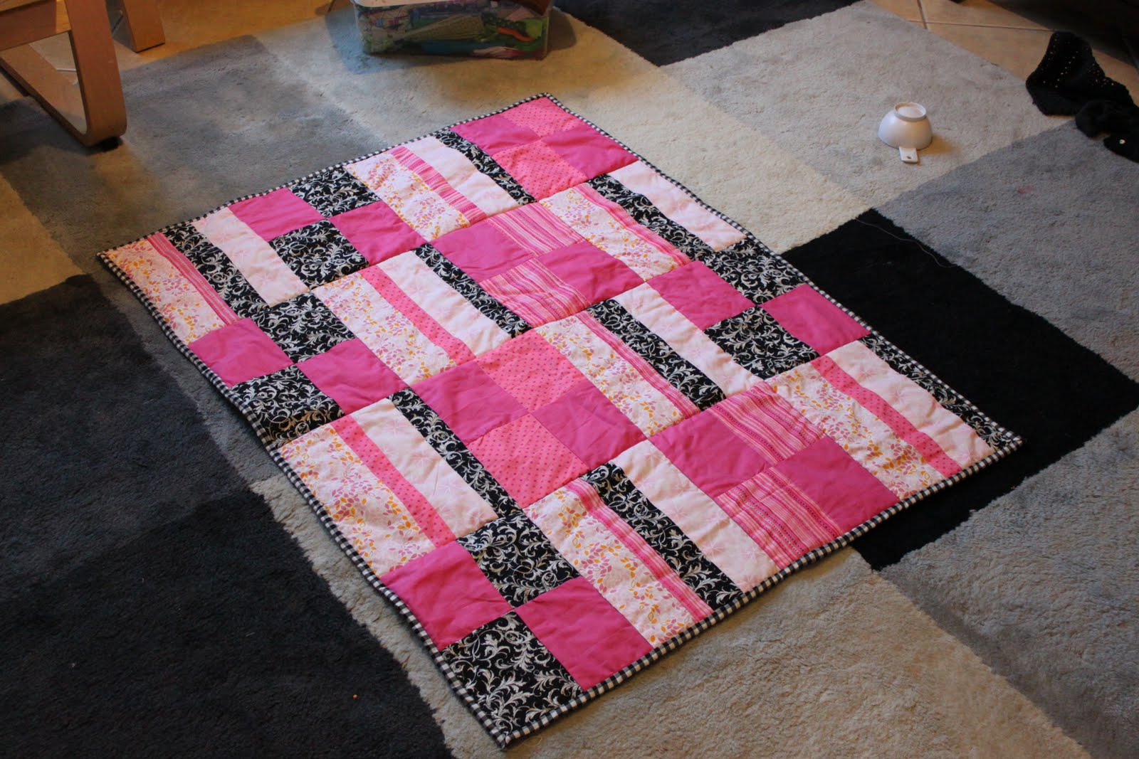 Baby Mulholland Baby quilt Pink and Black