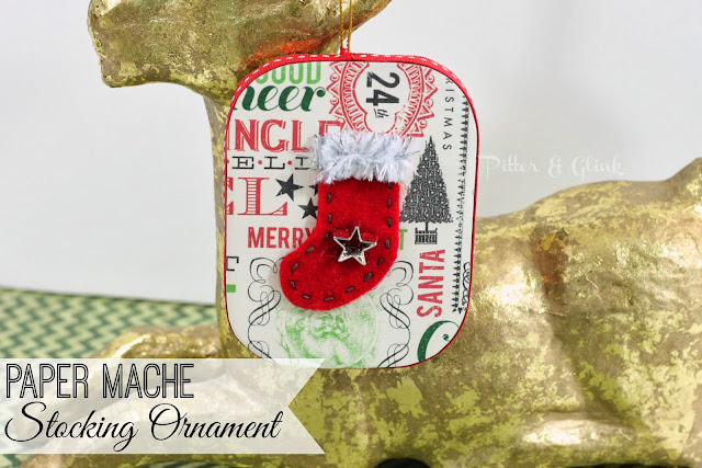 Make a vintage-inspired ornament complete with tiny felt stocking from a paper mache ornament!  Tutorial by Pitter and Glink