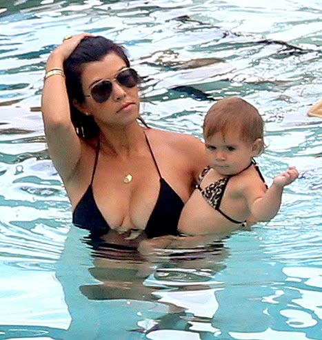 Kourtney Kardashian Sports One-Piece Swimsuit, Girl Penelope Wears Swimsuit Mother-daughter beach beauties! Kourtney Kardashian