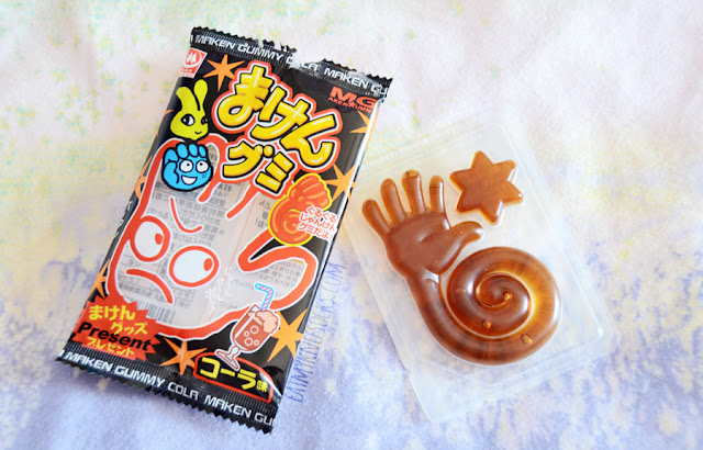 Skoshbox September 2015 DEKAbox Review: Maken Cola Gummies Soda-flavored candy is a unique and memorable Japanese treat, and these Maken Cola Gummies were one of many snacks included in the Skoshbox DEKAbox for September 2015.