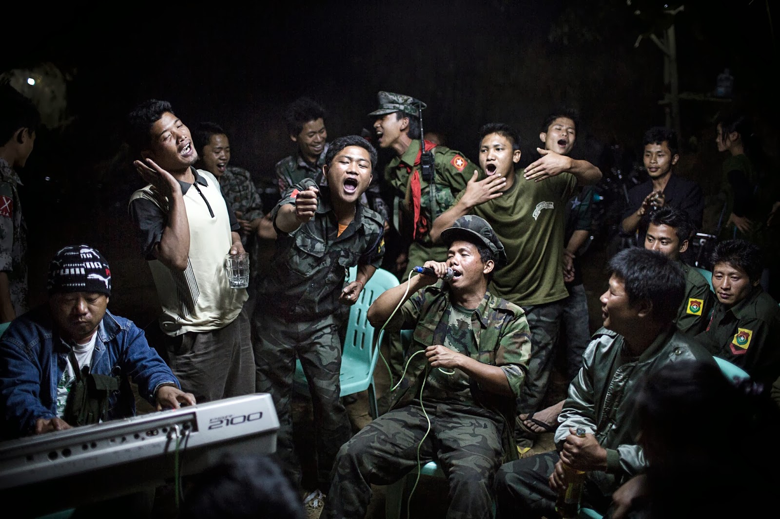 1st Prize Daily Life Single Julius Schrank, Germany, De Volkskrant 15 March 2013, Burma Kachin Independence Army fighters are drinking and celebrating at a funeral of one of their commanders who died the day before. The city is under siege by the Burmese army. world press photo, Julius Schrank