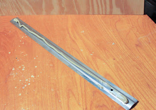 Recycled crafts: gluing in the magnet strip for the repurposed suitcase Recycled crafts: gluing in the magnet strip for the repurposed suitcase