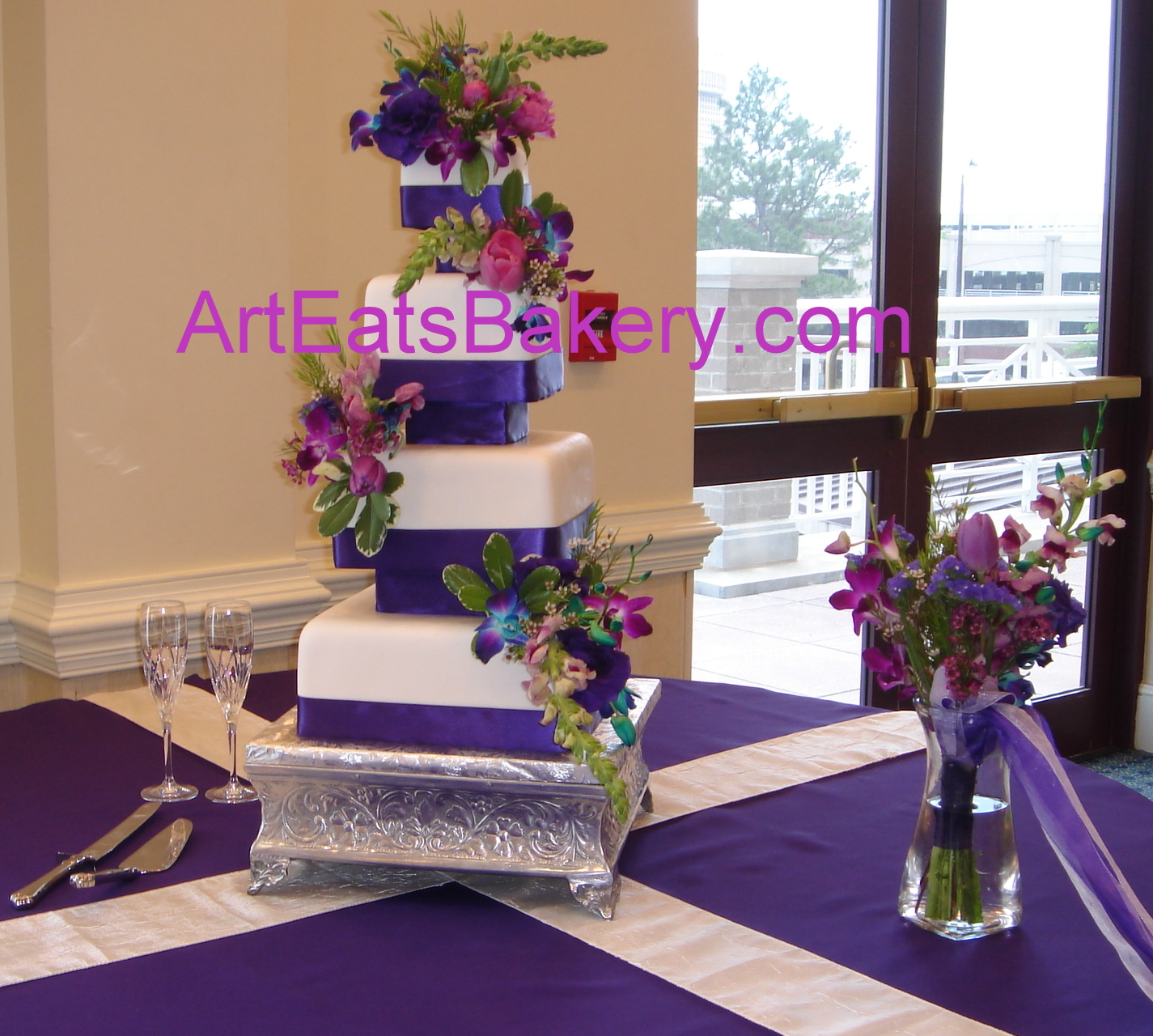 wedding cake ideas with flowers  wedding cake design with Purple ribbons, separators and flowers
