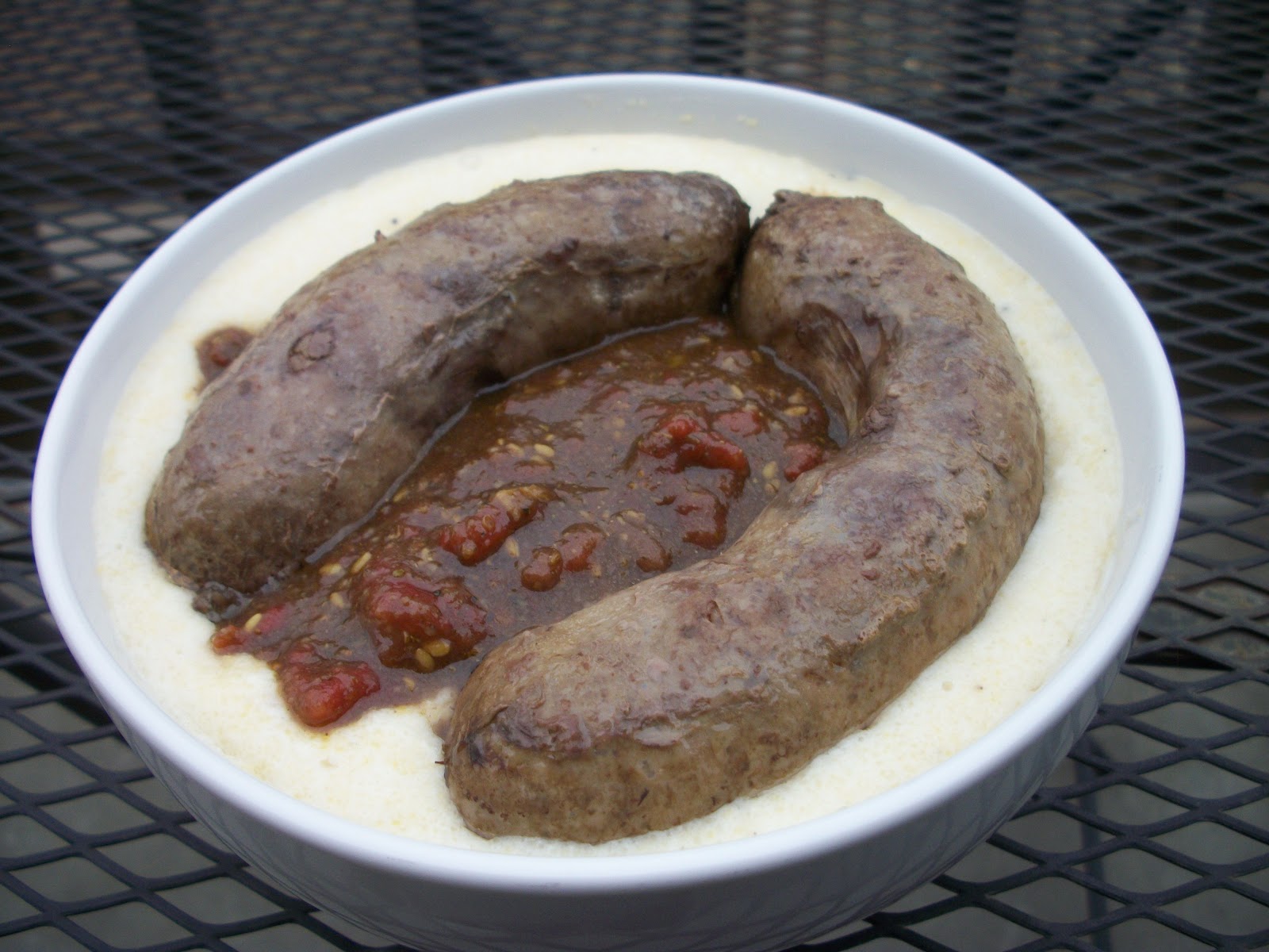 Spicy Lamb Sausage with Creamy Polenta and Zataar Tomato Sauce What's