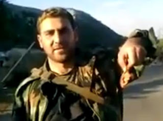 [صورة: تمثيل+بالجثث+و+عرض+للحوم+بشرية.JPG]