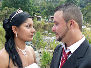 The happy wedding couple Groom and Bride gazing at one another