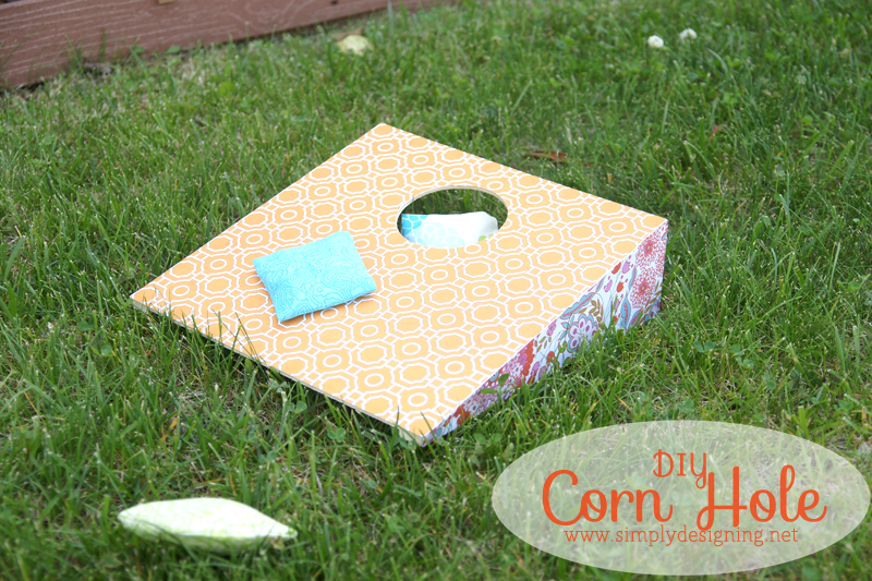 DIY Corn Hole | click to see how to create this really fun and simple corn hole game with bean bags! #cornhole #outdoorgames #kids #crafts