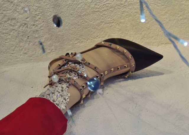 Black Rockstud pump by Valentino with red trousers