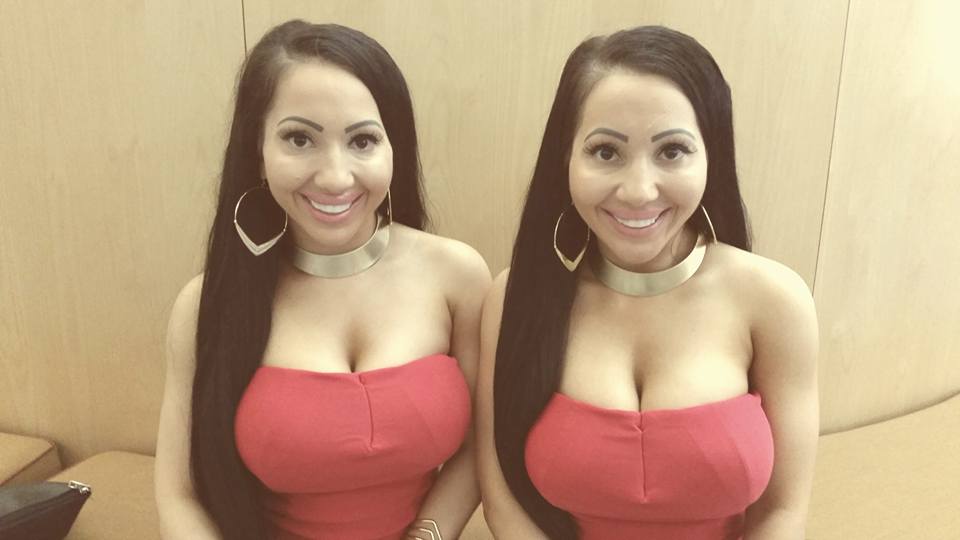 Identical Twin Sisters With Big Fake Tits Take On One Big Cock
