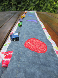 toy cars in pockets in the back of quilted colour matching table runner toy cars in pockets in the back of quilted colour matching table runner