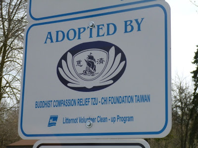New sign marks Tzu Chi adopting BRG in Port Credit. Sign at BRG gardens entrance recognizing Tzu Chi work in Port Credit.