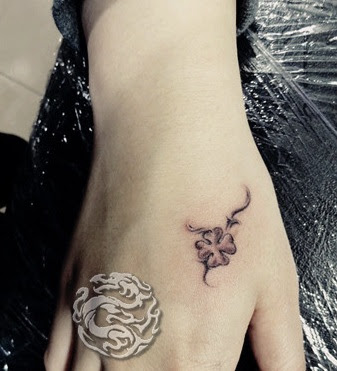 little flower tattoo on the hand