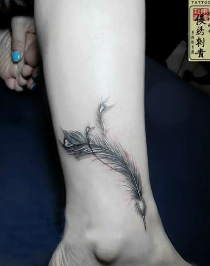 Peacock feather tattoo on the ankle