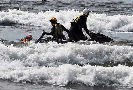 Surf rescue swimmers Eddie Mendez