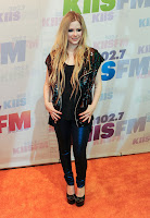 Avril Lavigne strikes a pose for cameras