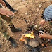 Syrian Army artillerymen brew coffee over campfire