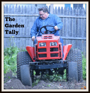 Husband plowing up the garden Vickie's Kitchen and Garden