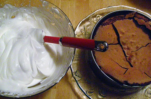 Bowl of Whipped Cream and Finished Chocolate Cake