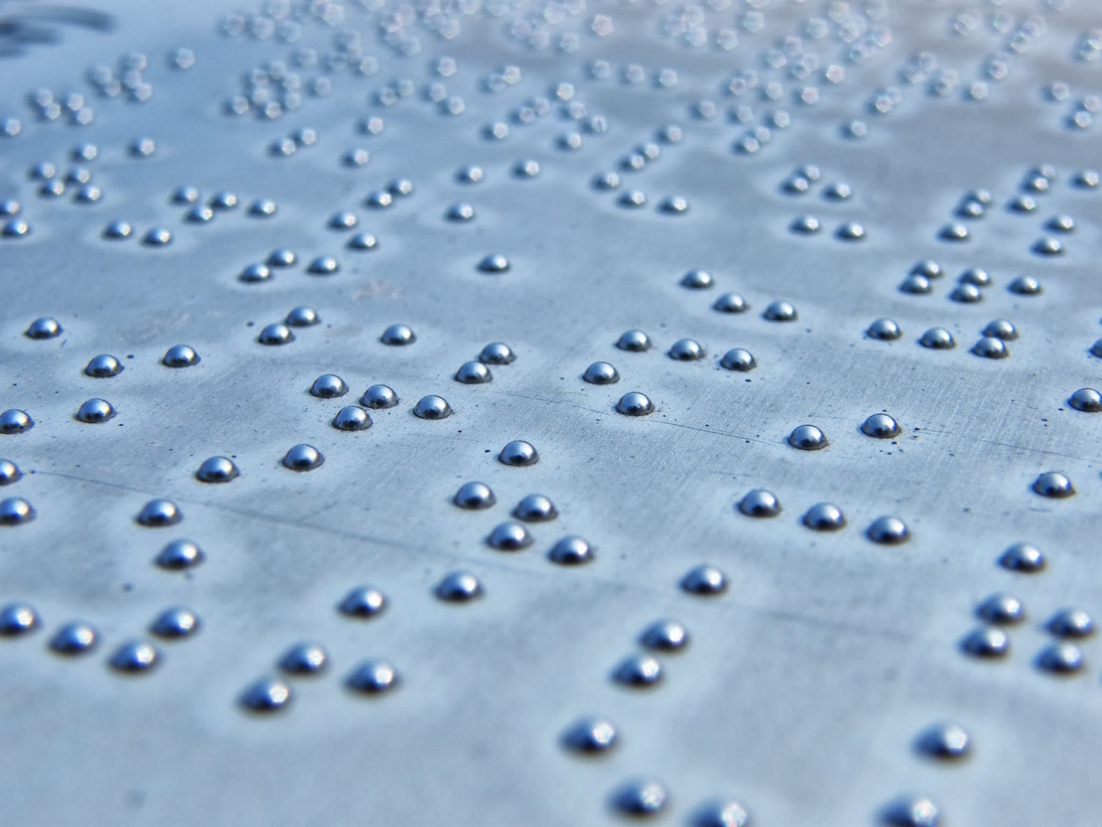 writing for the blind Braille is a system of touch reading and writing for blind persons in which raised dots represent the letters of the alphabet braille also contains equivalents for punctuation marks and provides symbols to show letter groupings. writing for the blind Braille is a system of touch reading and writing for blind persons in which raised dots represent the letters of the alphabet braille also contains equivalents for punctuation marks and provides symbols to show letter groupings.