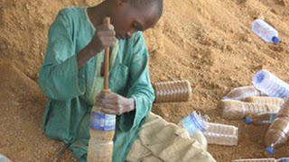 Lots of homeless children are hired to stuff sand into the bottles.