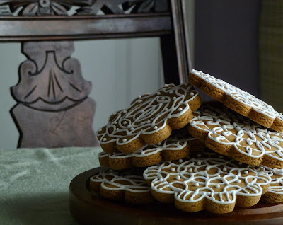 wood plate and carved chair with gourmet gingerbread cookies