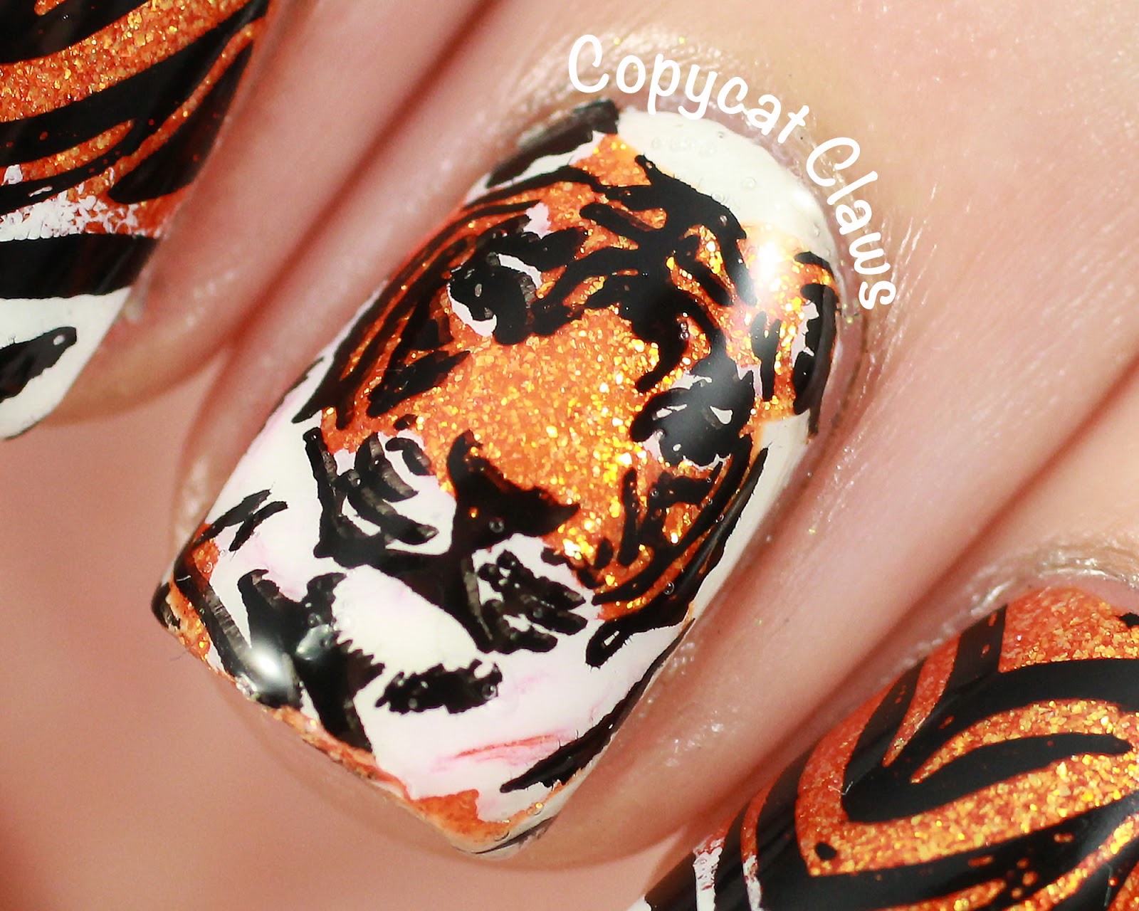 Gold tiger nail design - wide 8