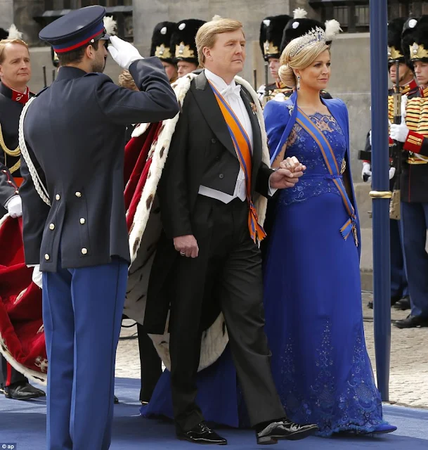 Dutch King Willem-Alexander is given three cheers by guests and his wife Queen Maxima inside the Nieuwe Kerk or New Church