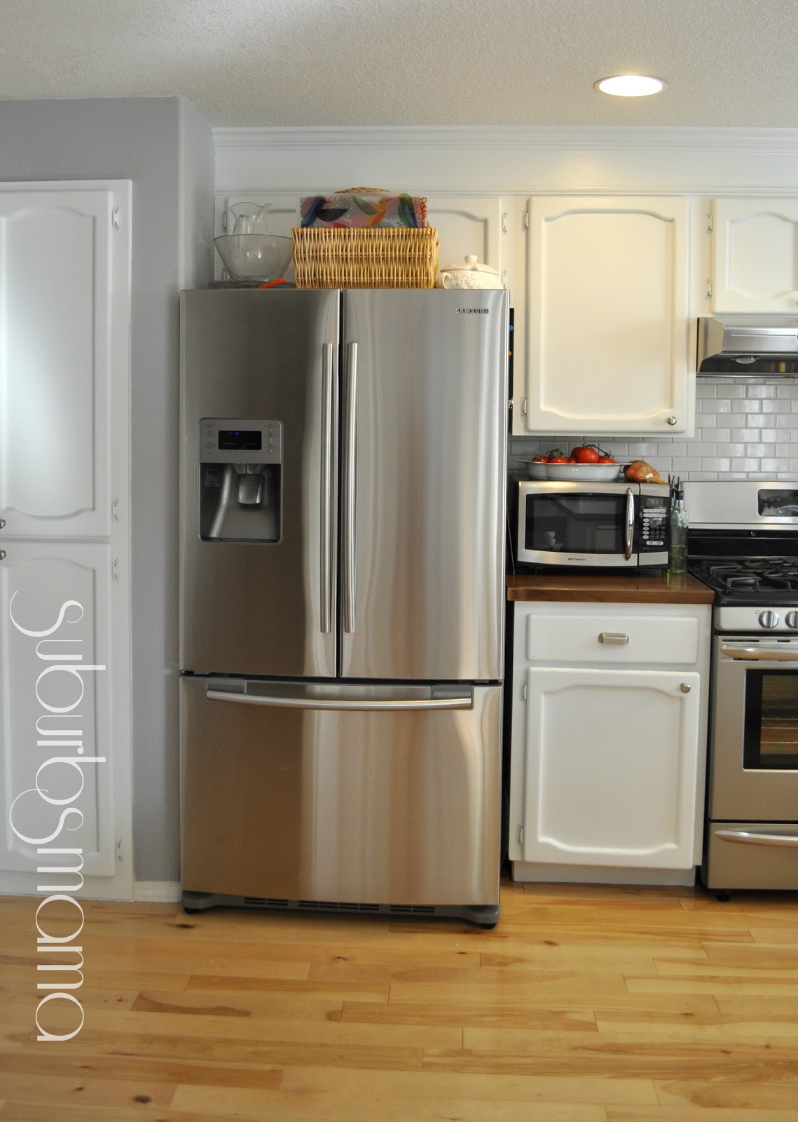 White kitchen cabinets with butcher block countertops Kitchen Update One Year Later (white cabinets and butcher block