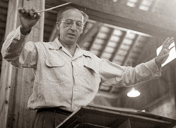 Aaron Copland conducting an orchestra at age 75