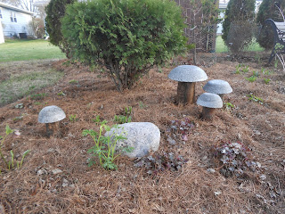 Hypertufa and wood mushrooms in the garden
