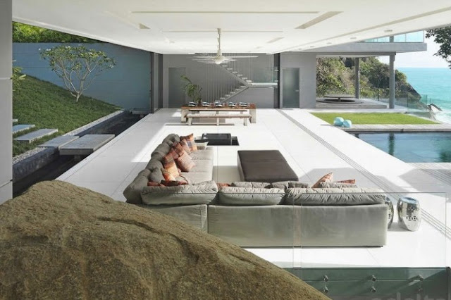 Photo of modern living room and dining room as seen from the large rock in the house