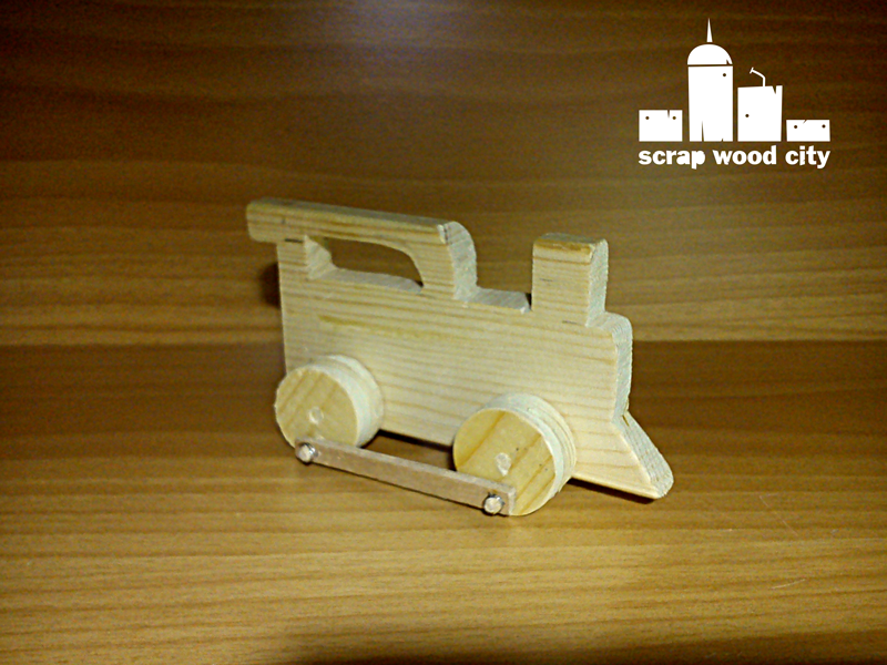scrap wood city: Wooden toy train in action