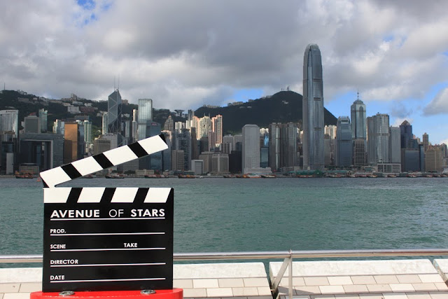 Stunning view of modern skyline buildings across Victoria Harbour from the promenade of Avenue of Stars in Tsim Sha Tsui, Kowloon, Hong Kong Stunning view of modern skyline buildings across Victoria Harbour from the promenade of Avenue of Stars in Tsim Sha Tsui, Kowloon, Hong Kong
