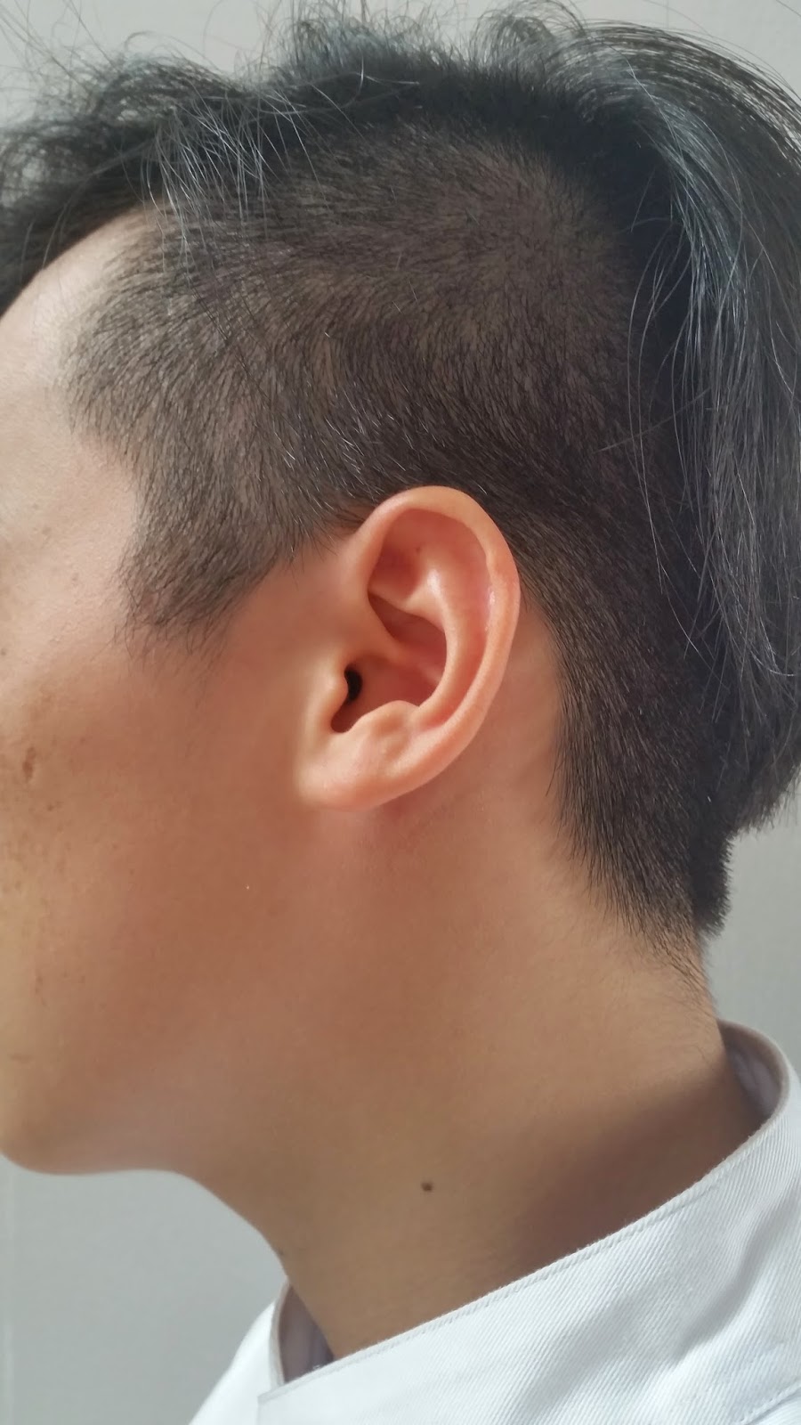 Coin penetration magic trick Hair been shaved