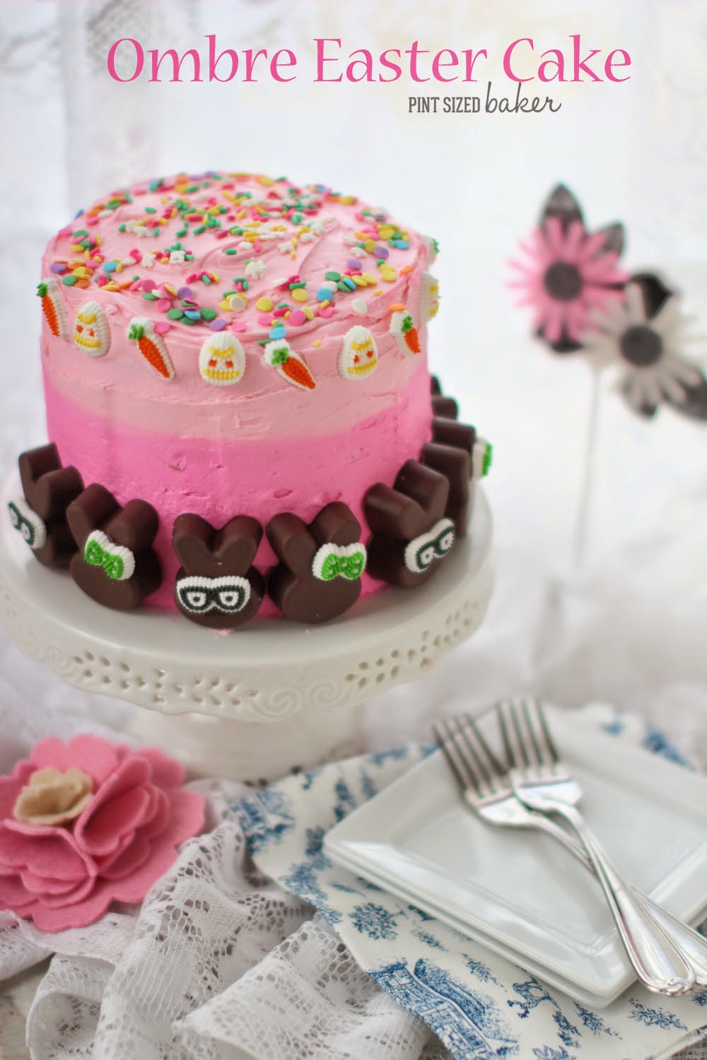 Five layer Ombre Easter Cake with pink ombre frosting and chocolate bunnies and Spring sprinkles.