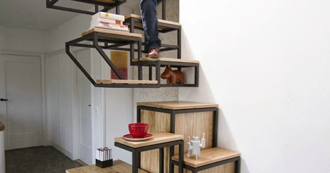 Una escalera suspendida del techo con espacios de almacenamiento