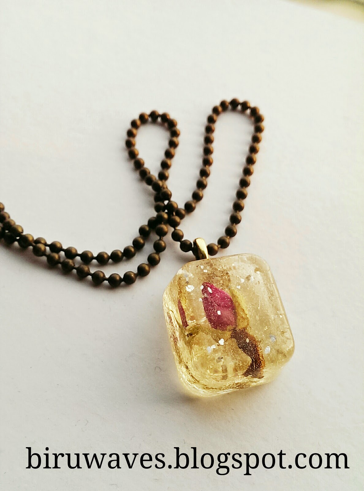 Unique Handmade Jewellery Resin with embedded Rose pendant.