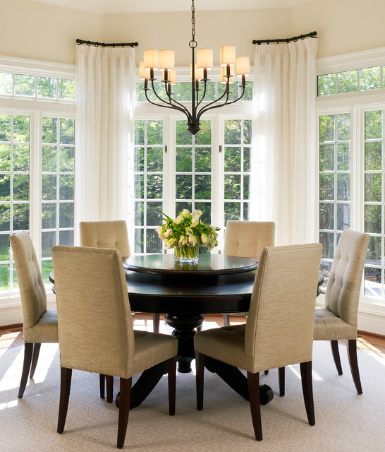 Black Round Dining Tables for Various Dining Room Designs Innovative Iron Chandelier in the Dining Room with Round Dining Tables and Brown Chairs near Glass Windows